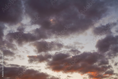 yellow and orange clouds at sunset. dramatic sky skyline background 
