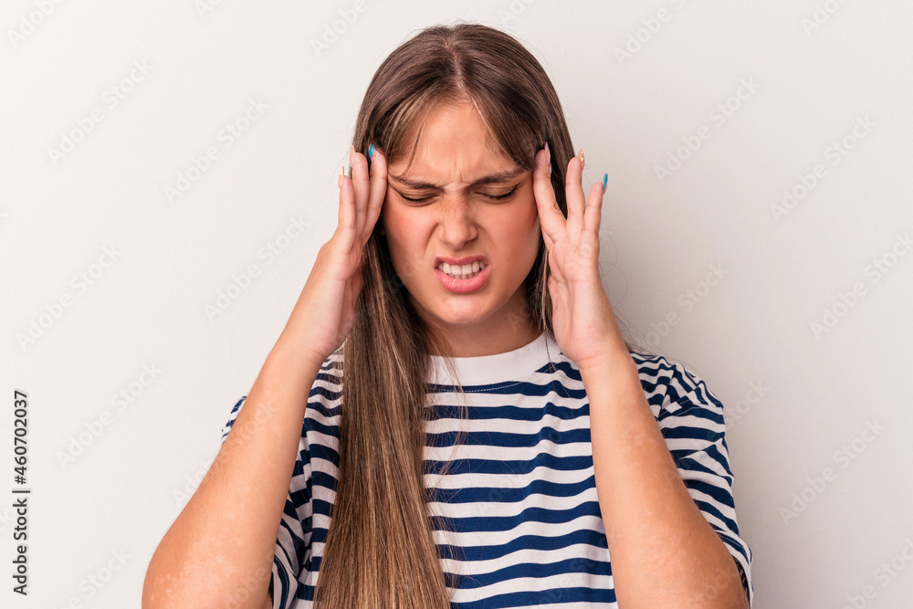 Young caucasian woman isolated on white background having a head ache, touching front of the face. Young caucasian woman isolated on white background having a head ache, touching front of the face.