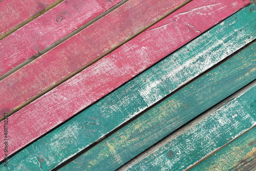 Old wooden texture with grunge pink and blue paint