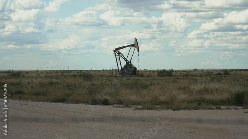 An oil well and pump jack in Texas photo