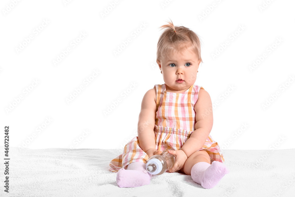 Cute baby girl with bottle of water on white background Cute baby girl with bottle of water on white background