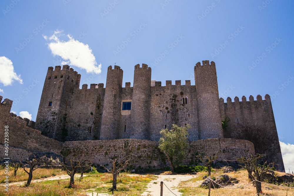 ancient stone castle under blue sky