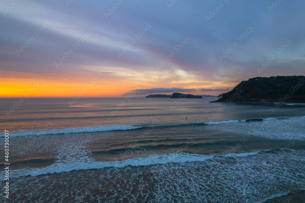 Fototapeta premium Colourful high cloud covered sunrise seascape