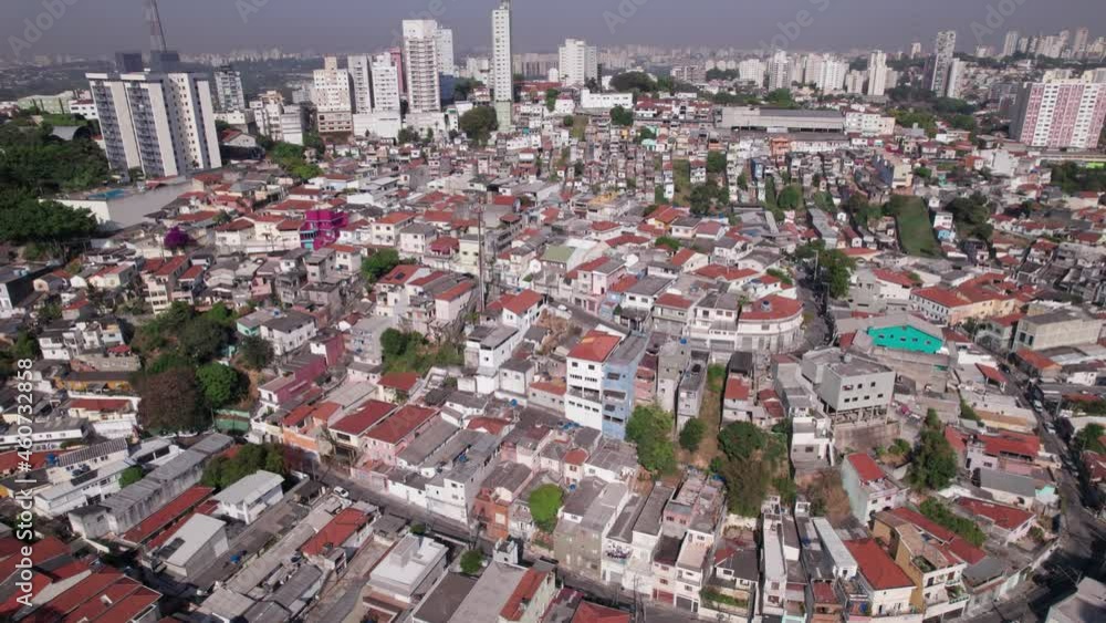 Tightly populated hillside in the biggest city in South America, Sao Paulo Brazil. The calm residential area is called Vila Madalena. Smooth parallel flight showing the city pass by in the distance. Tightly populated hillside in the biggest city in South America, Sao Paulo Brazil. The calm residential area is called Vila Madalena. Smooth parallel flight showing the city pass by in the distance.