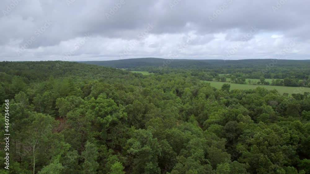 Aerial with slow pan over beautiful southern Missouri landscape on a cloudy summer day. Aerial with slow pan over beautiful southern Missouri landscape on a cloudy summer day.
