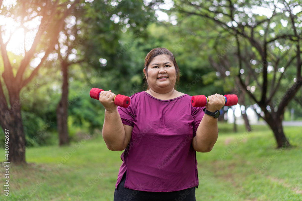 Asian fat woman workout outdoors exercising in park, Sport and recreation for weight loss idea concept. Asian fat woman workout outdoors exercising in park, Sport and recreation for weight loss idea concept.