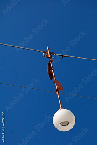 hanging street lamp in Gavle with blue sky photo