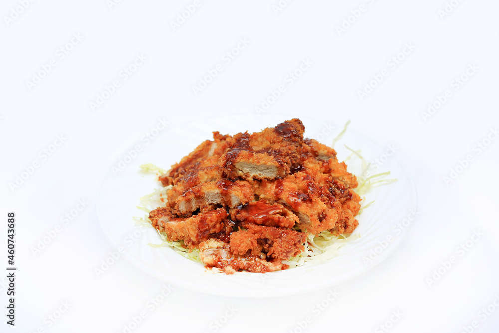 Pork cutlet tonkatsu, Japanese fried pork in plate on white background Pork cutlet tonkatsu, Japanese fried pork in plate on white background