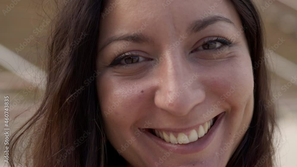 Portrait of a smiling woman looking at the camera. Cheerful people with positive face. People of mixed race. Portrait of a smiling woman looking at the camera. Cheerful people with positive face. People of mixed race.