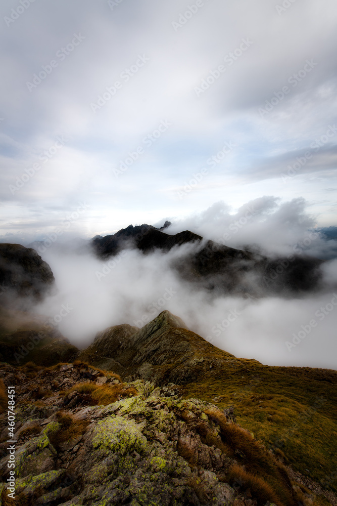 Mountain landscape with clouds around the peaks