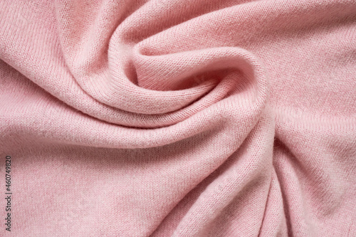 The texture of the pink cashmere sweater. Top view, close-up.