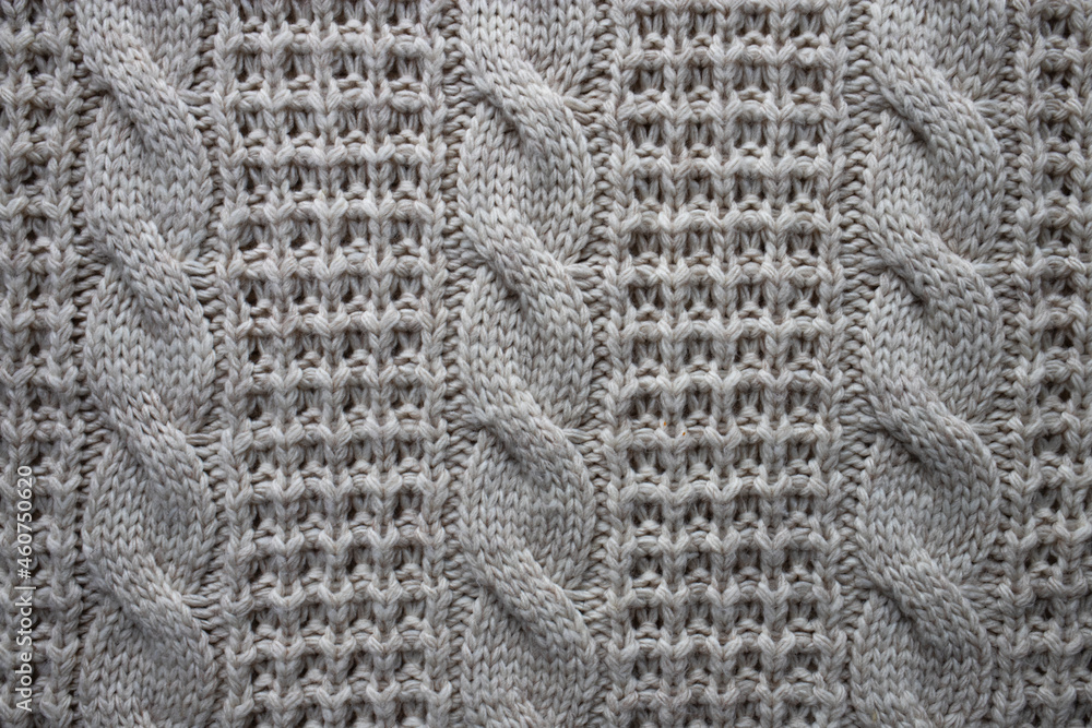 Woolen knitted sweater texture. Top view, close-up. Woolen knitted sweater texture. Top view, close-up.