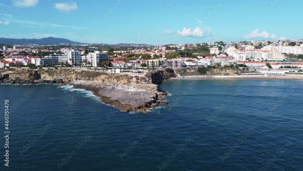 Rocky Shore With Waterfront Cityscape At Sao Pedro do Estoril In Portugal. Aerial Wide Rocky Shore With Waterfront Cityscape At Sao Pedro do Estoril In Portugal. Aerial Wide