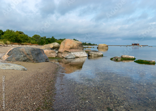 The unusual landscape of Kaltene beach, formed by large boulders covering the coast, morning hour, Kaltene rocky seashore, Latvia photo