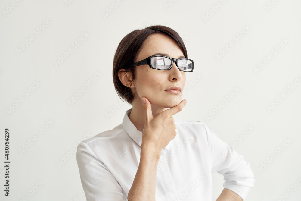 Businesswoman with glasses self-confidence light background Businesswoman with glasses self-confidence light background