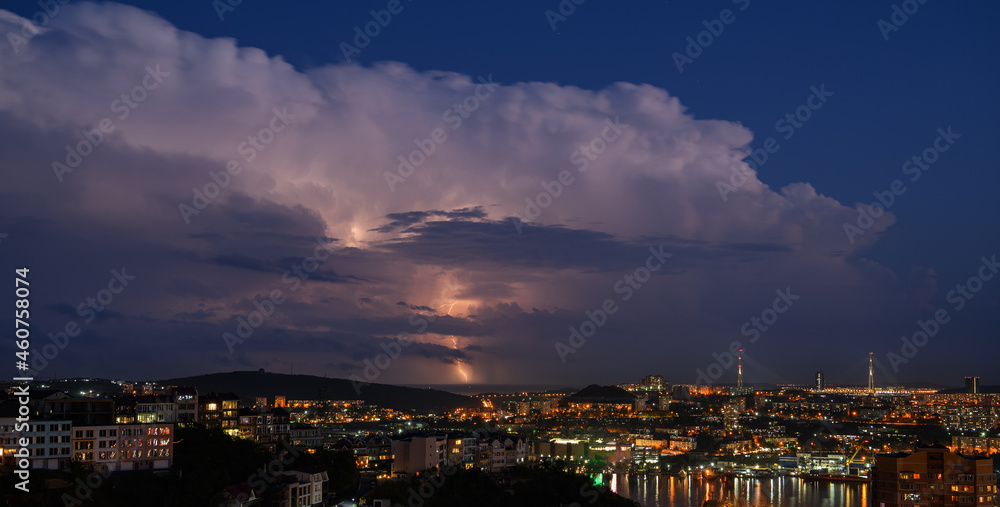 Fototapeta premium Lightning storm at night over city.
