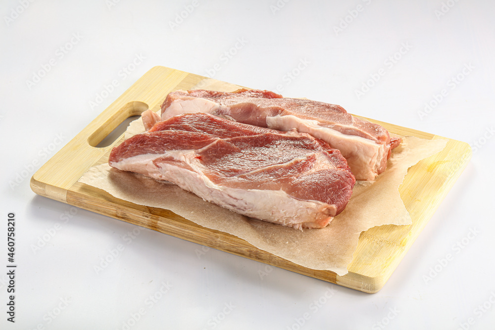 Raw pork fillet over board Raw pork fillet over board