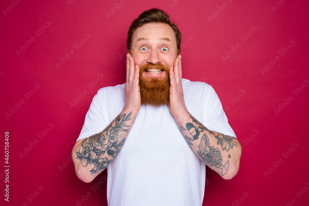 Happy isolated man with beard and white t-shirt Happy isolated man with beard and white t-shirt