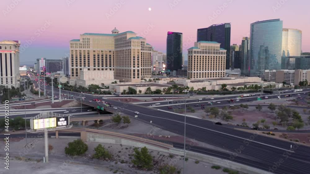 Aerial: Las Vegas City skyline and freeway at sunset, Nevada, USA Aerial: Las Vegas City skyline and freeway at sunset, Nevada, USA