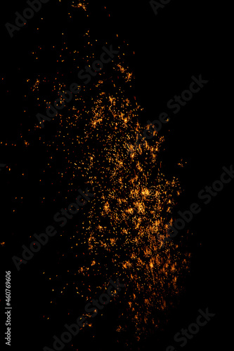 blurry sparks from fireworks on black background