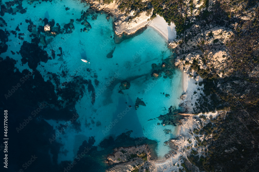 View from above, stunning aerial view of Spargi Island with Cala Corsara, a white sand beach bathed by a turquoise water. La Maddalena archipelago National Park, Sardinia, Italy.
