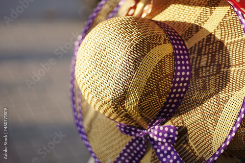 Hanging straw hat in the sunlight.
