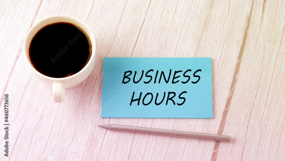 BUSINESS HOURS text on blue sticker with cofee and pen BUSINESS HOURS text on blue sticker with cofee and pen