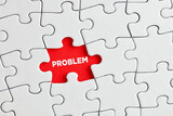 The word problem written on red missing puzzle piece. To discover a hidden problem
