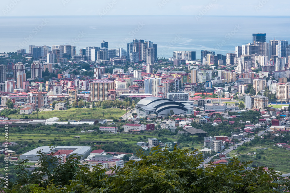 Fototapeta premium ariel panoramic view of old city and skyscrapers with the sea from the mountains