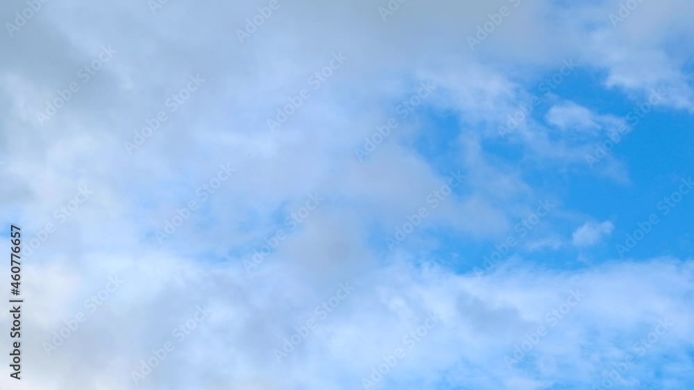 Beautiful white clouds float across the blue sky in sunny day with good weather Beautiful white clouds float across the blue sky in sunny day with good weather