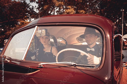 Young couple in retro car