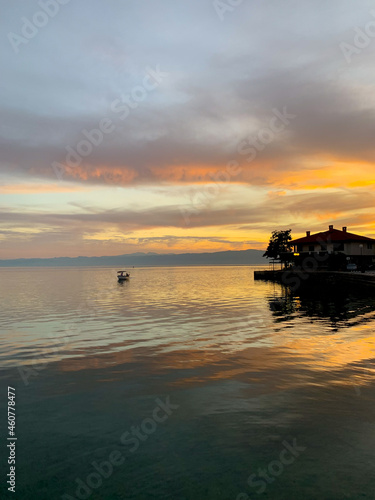 Fantastic colors of the sunset, colorful clouds and sky reflection on the surface of the water, magic lake, natural background, wallpaper