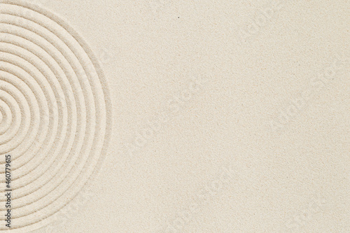 Lines drawing on sand, beautiful sandy texture. Spa background, concept for meditation and relaxation