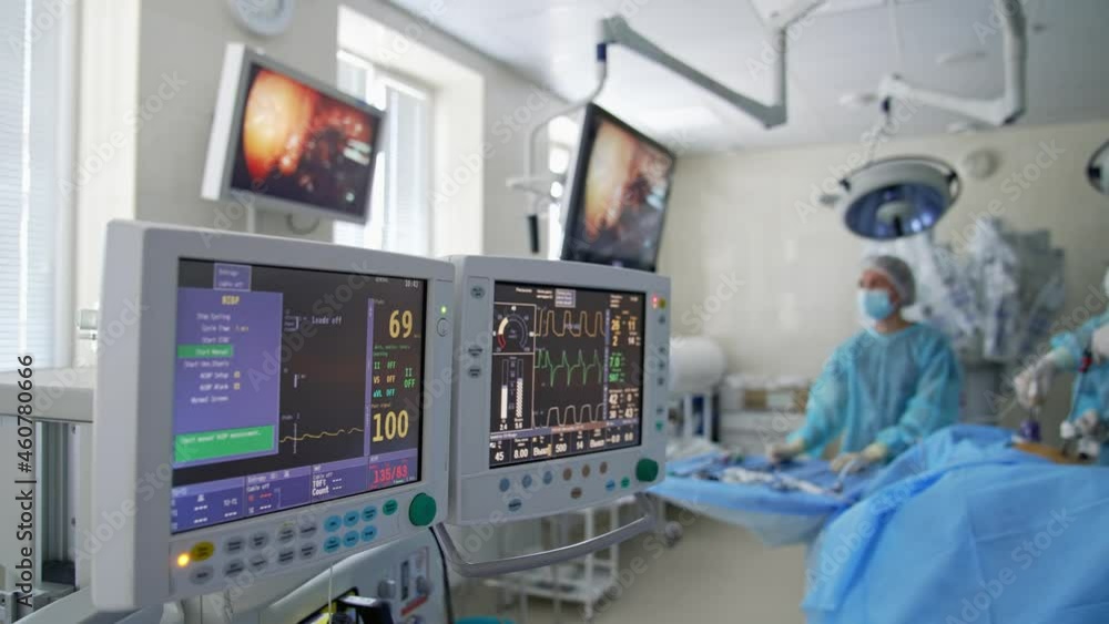 Monitors in intensive care unit. Heart beat of a patient on the screen of computers during operation in the hospital. Healthcare concept. Monitors in intensive care unit. Heart beat of a patient on the screen of computers during operation in the hospital. Healthcare concept.