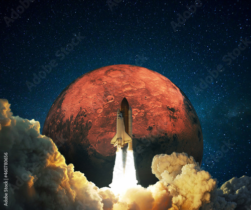 Fototapeta Naklejka Na Ścianę i Meble -  New space rocket successfully launched into space with clouds of smoke to the red planet Mars. Spaceship lift off on space mission on a background of deep space and red planet, concept