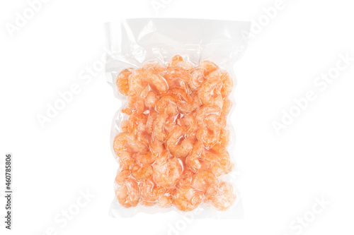 Shrimps in a plastic vacuum bag isolated on a white background. Vacuum packaged food.
