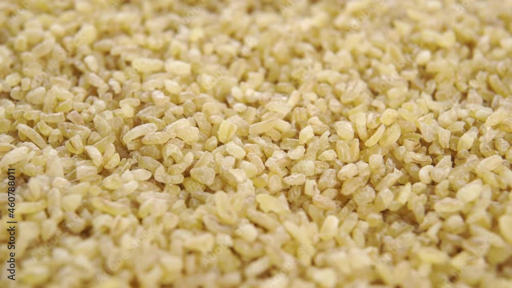 Dry wheat bulgur grain. Macro. Rotation Dry wheat bulgur grain. Macro. Rotation