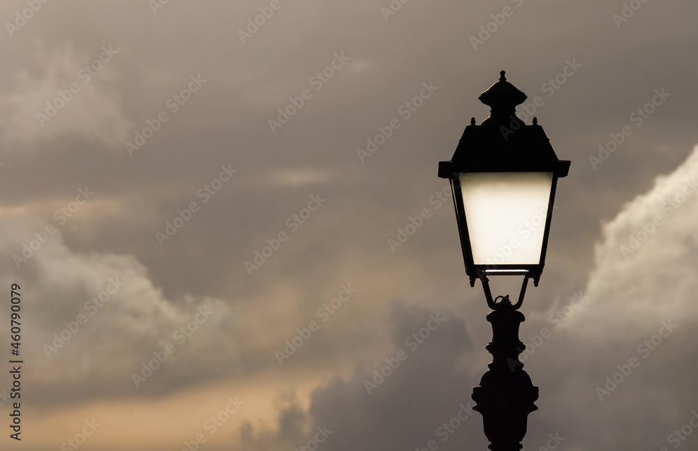 Old fashioned street lamp against cloudy sky (with copy space) Old fashioned street lamp against cloudy sky (with copy space)
