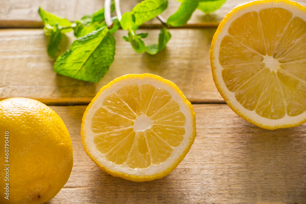 Fresh lemons and peppermint on wooden background. Fresh lemons and peppermint on wooden background.
