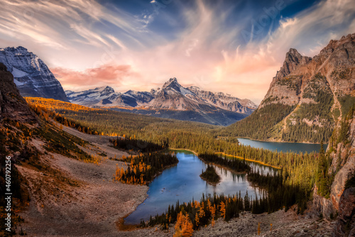 Scenic View of Glacier Lake with Canadian Rocky Mountains in Background. Dramatic Fall Sunset Sky Art Render. Located in Lake O'Hara, Yoho National Park, British Columbia, Canada.