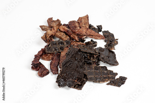 The pile of dehydrated beef products for dogs, cutt lungs and liver. Homemade pet treats. White background, copy space.