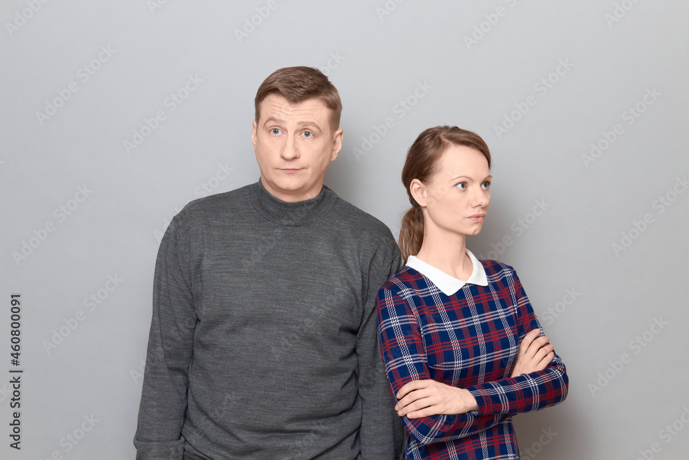 Portrait of couple after quarrel or unpleasant conversation Portrait of couple after quarrel or unpleasant conversation