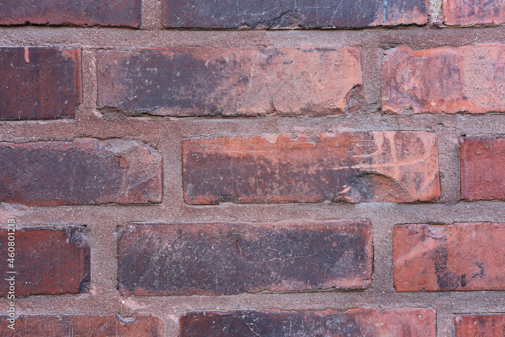 Texture of a red brick wall wall in a closeup. Texture of a red brick wall wall in a closeup.