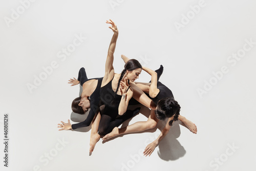 High angle view. Modern ballet performance. Group of modern dancers, art contemp dance, black and white, combination of emotions