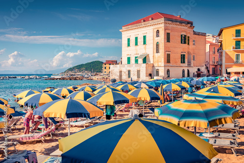 Hot summer dey on Santa Maria di Castellabate puclic beach. Picturesque outdoor scene of Italy, Europe. Vacation concept background..