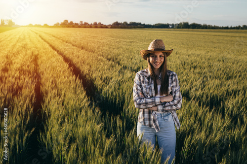 woman farmer standing in wheat field