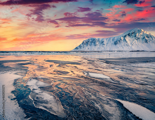 Exciting winter view of Lofoten Islands. Great sunrise in Norway. Stunning morning view of popular tourist destination - Skagsanden beach, Flakstadoya island. Beauty of nature concept background..