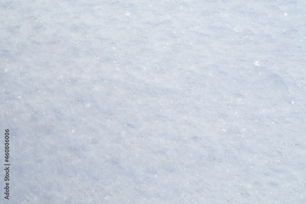 Close-up of fresh snowy land in the winter, viewed from above. Abstract full frame textured background. Copy space. Top view.
