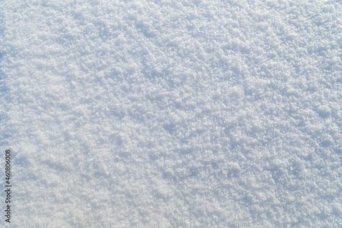 Close-up of fresh snowy land in the winter, viewed from above. Abstract full frame textured background. Copy space. Top view.