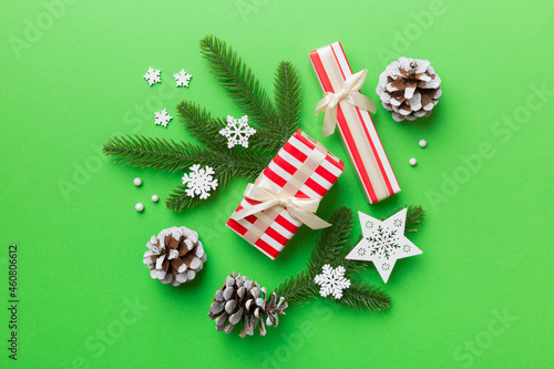 Christmas decorations and fir tree branch and gift boxon dark table. Top view frame with copy space photo